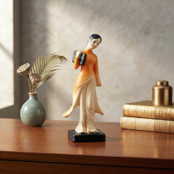 VM476-1 Standing Lady in Yellow Flowing Tunic Figurine – Folk Art Tabletop Statue on Pedestal