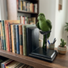 Perched Emerald Parakeet Bookend Figurine on Stepped Ebony Stand – Avian Tabletop Sculpture (12×20 cm)